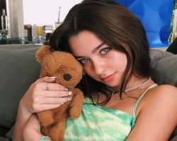 The star loves to play with a cute cuddly teddy bear.